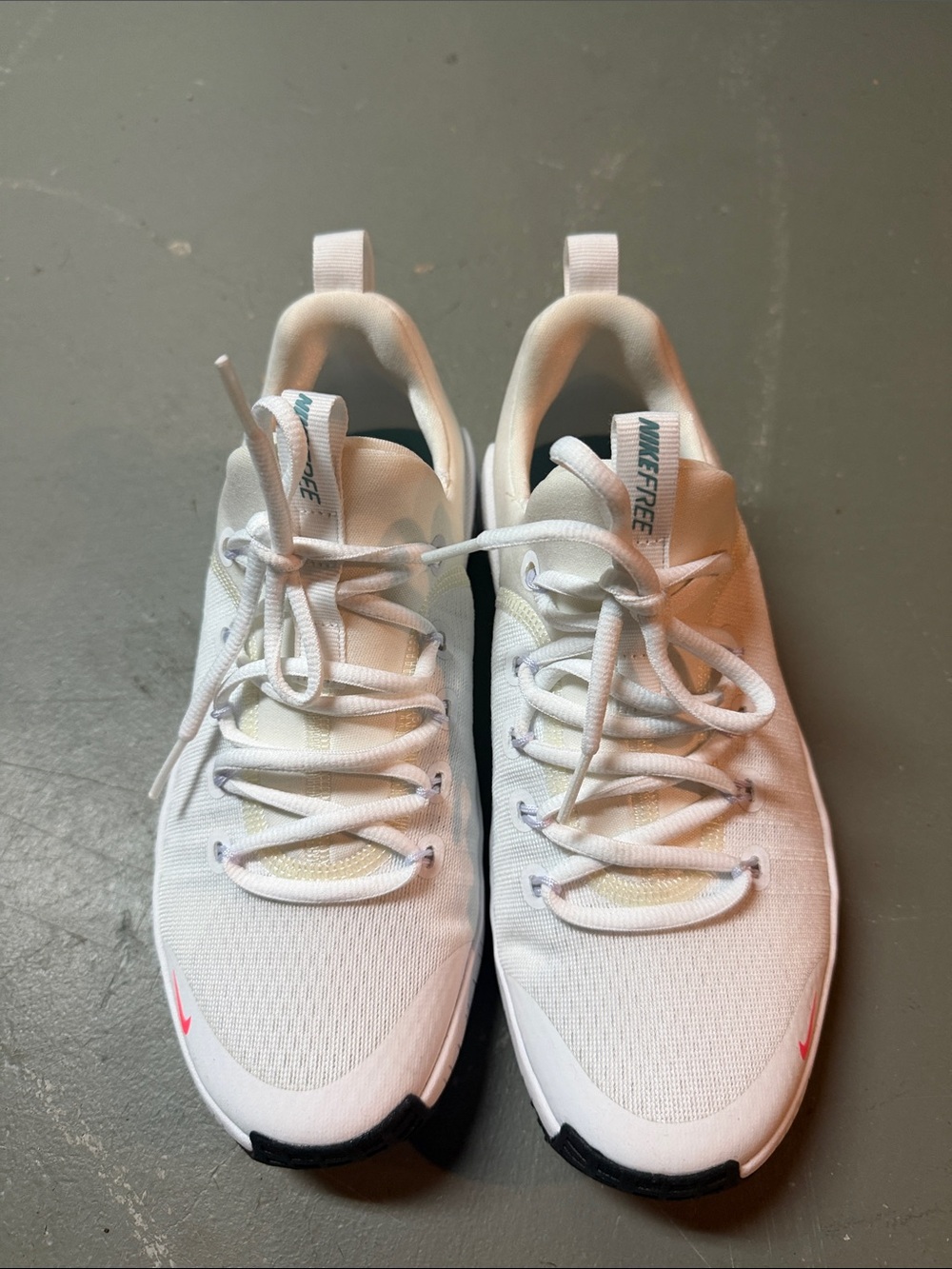 Nike Free Women’s White Sneakers with Pink Accent